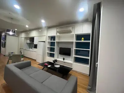 a living room with a couch and a table at Platinum KLCC & Bukit Bintang in Kuala Lumpur