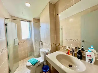 a bathroom with a sink and a toilet and a shower at Couple Suite at Casa Mutiara 5 mins walk to LRT, Jalan Alor and Bukit Bintang in Kuala Lumpur