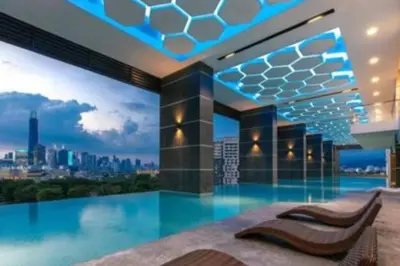 a house with a pool with a view of a city at Lavile Premier Suite Cheras 5 - 6 pax 3R2B in Kuala Lumpur