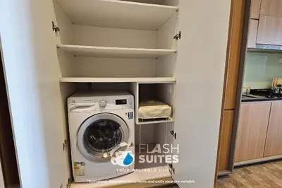 a washer and dryer in a small kitchen at Expressionz Premium Suites @ KLCC in Kuala Lumpur