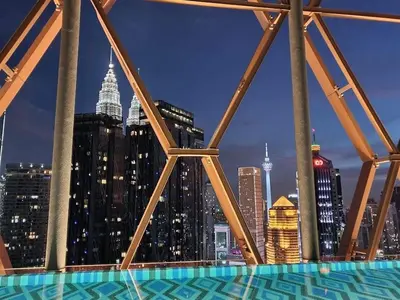 a view of a city skyline at night at Scarletz Suites KLCC by M Suites in Kuala Lumpur