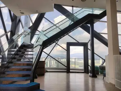 a staircase in a building with a glass ceiling at City-View Studio Retreat with Spectacular View TRX in Kuala Lumpur