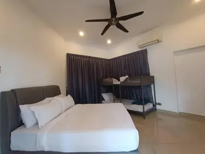 a bedroom with a bed and a ceiling fan at Titiwangsa9 Bungalow Pool Villa in Kuala Lumpur