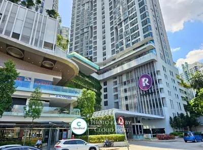 a tall building with cars parked in front of it at The Robertson Bukit Bintang Kuala Lumpur by Cloud Host in Kuala Lumpur