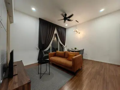 a living room with a couch and a ceiling fan at Una Serviced Apartment, Jalan Peel by Rverse Suite in Kuala Lumpur