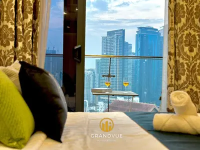 a room with a bed and a view of a city at Dorsett Residence Bukit Bintang 3MinsTo Pavilion By HeyStay Management in Kuala Lumpur