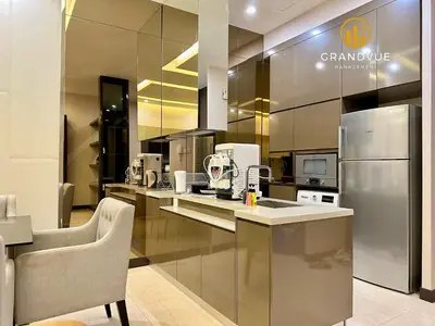 a kitchen with a stainless steel refrigerator and a counter at Dorsett Residence Bukit Bintang 3MinsTo Pavilion By HeyStay Management in Kuala Lumpur