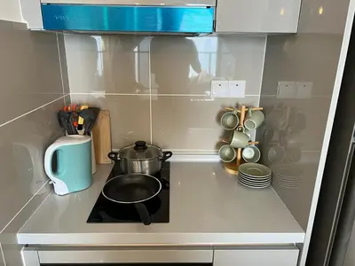 a kitchen counter with a stove with a pot on it at KLCity & KLCC View Modern Style 2R2B - 6 pax in Kuala Lumpur