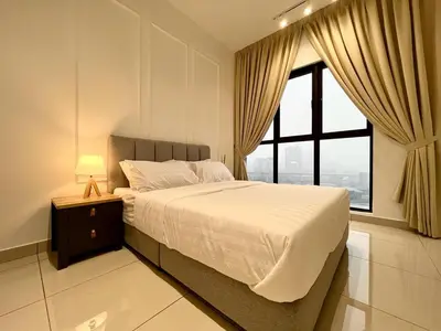 a bedroom with a large bed and a window at KLCity & KLCC View Modern Style 2R2B - 6 pax in Kuala Lumpur
