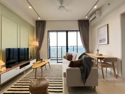 a living room with a couch and a television at KLCity & KLCC View Modern Style 2R2B - 6 pax in Kuala Lumpur