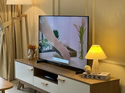 a flat screen tv sitting on top of a dresser at KL City View 2R1B Free Wifi 6pax in Kuala Lumpur