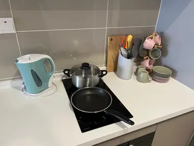a stove top with a pot on top of it at KL City View 2R1B Free Wifi 6pax in Kuala Lumpur