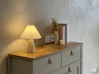 a table with a lamp on top of a dresser at KL City View 2R1B Free Wifi 6pax in Kuala Lumpur