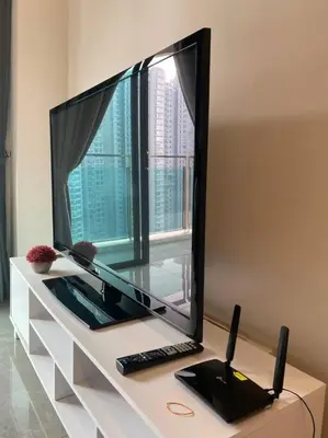 a flat screen tv sitting on top of a table at Ooak Residence in Mont Kiara, Kuala Lumpur in Kuala Lumpur