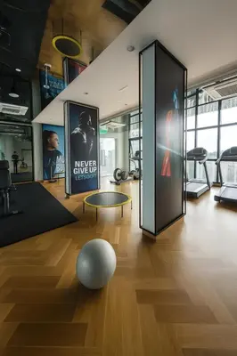a room with posters on the wall and a ball on the floor at Ooak Residence in Mont Kiara, Kuala Lumpur in Kuala Lumpur
