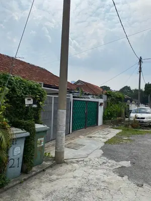 a pole in front of a house with a garage at Cheras homestay @kelian in Kuala Lumpur