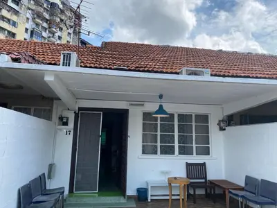 a white house with chairs and a table at Cheras homestay @kelian in Kuala Lumpur
