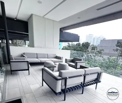 a room with couches and chairs on a building at Lucentia Residence by EAS Maju property in Kuala Lumpur