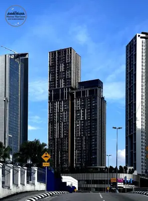 a group of tall buildings in a city at Lucentia Residence by EAS Maju property in Kuala Lumpur