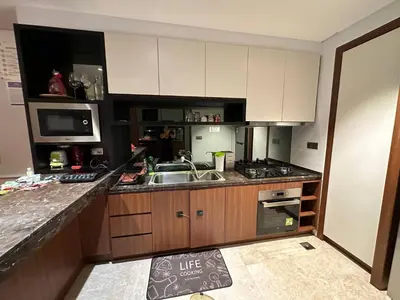 a kitchen with a sink and a counter top at Luxurious Condo in Heart of Kuala Lumpur with Rooftop Garden in Kuala Lumpur