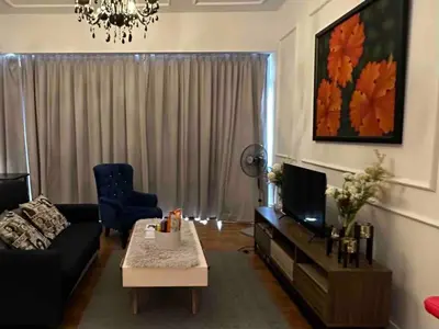a living room with a couch and a tv at Luxurious Condo in Heart of Kuala Lumpur with Rooftop Garden in Kuala Lumpur