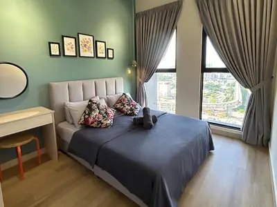 a bedroom with a bed with a teddy bear on it at Trion KL High floor Corner Unit Free Parking Near TRX KL Centre and MRT in Kuala Lumpur