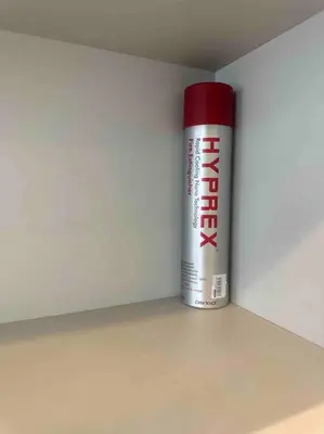 a red and white can sitting in a corner at The Robertson Residence KL Bukit Bintang Chinatown Jalan Alor by \u54c1\u5c4b PINWU Shortstay in Kuala Lumpur