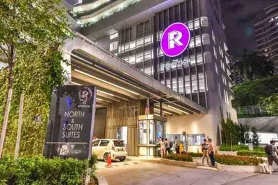a building with a purple sign on the side of it at The Robertson Residence KL Bukit Bintang Chinatown Jalan Alor by \u54c1\u5c4b PINWU Shortstay in Kuala Lumpur