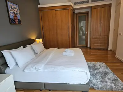 a bedroom with a large bed with a towel on it at Stylish Large 3guests 1br St Mary Residences in Kuala Lumpur