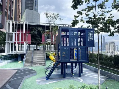 a playground in a city with a blue structure at LUCENTIA RESIDENCE BY HOME HORIZON in Kuala Lumpur