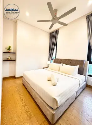 a bedroom with a bed with a ceiling fan at LUCENTIA RESIDENCE BY HOME HORIZON in Kuala Lumpur