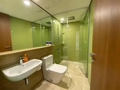 a bathroom with a toilet and a sink and a shower at Sky Suite @ KLCC - 3BR KLCC View in Kuala Lumpur
