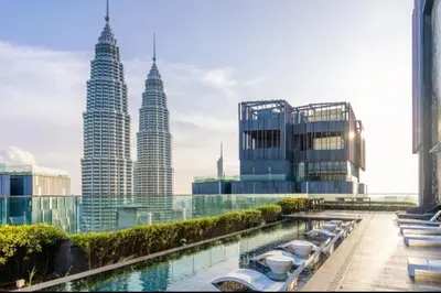 a view of the petronas twin towers from a building at Star residence by KLCC in Kuala Lumpur