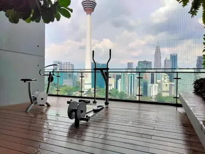 a gym with a view of a city skyline at Ceylonz Suites Bukit Bintang by KL ONE in Kuala Lumpur