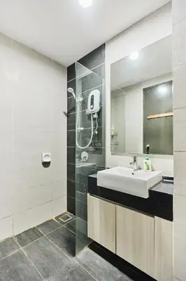 a bathroom with a sink and a shower at Q Suite @ Queensville Kuala Lumpur by Moka in Kuala Lumpur