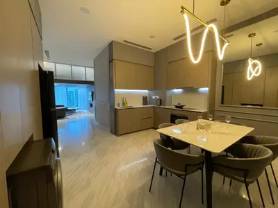 a kitchen and dining room with a table and chairs at Eaton Residences KLCC by Romeo Bnb in Kuala Lumpur