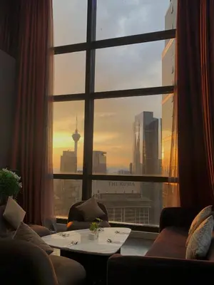 a room with a window with a view of a city at 8 Kia Peng Suites KLCC by Luna in Kuala Lumpur