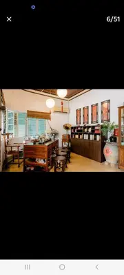 a living room with a table and some chairs at Ming Yuan Homestay in Kuala Lumpur
