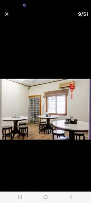 a room with tables and benches and a window at Ming Yuan Homestay in Kuala Lumpur