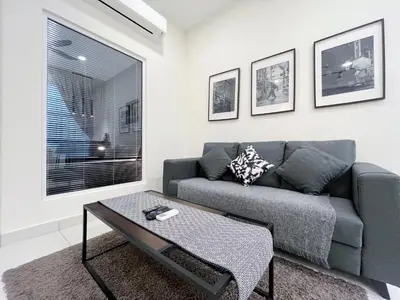 a living room with a couch and a coffee table at Arte Mont Kiara by Yan Yee in Kuala Lumpur