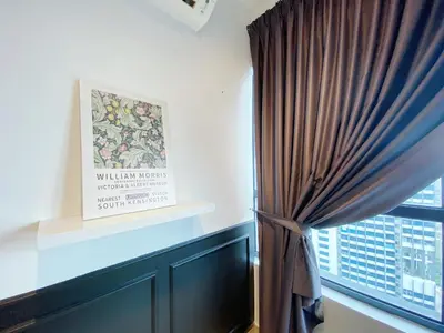 a room with a window with a curtain and a picture at Arte Plus Ampang in Kuala Lumpur