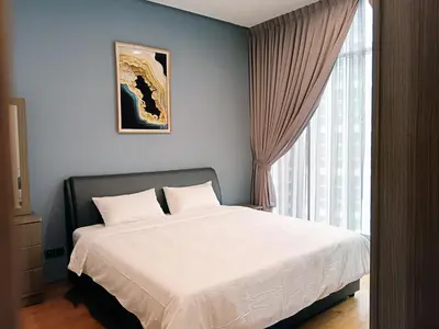 a bedroom with a white bed and a window at Soho Suites KLCC by Minsha in Kuala Lumpur
