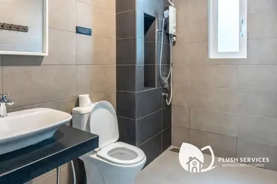 a bathroom with a toilet and a sink at Inspirasi@Mont Kiara in Kuala Lumpur
