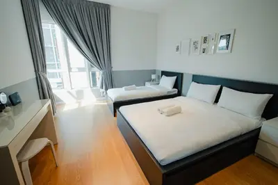 a small room with two beds and a desk at Inspirasi@Mont Kiara in Kuala Lumpur