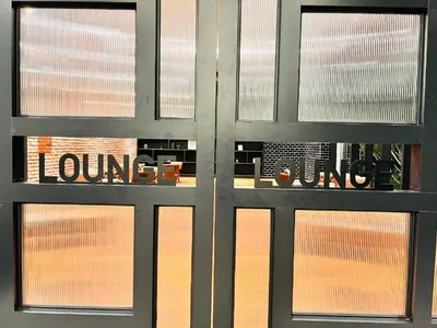a metal door with the words loungesound on it at Chambers Platinum Suite Kuala Lumpur in Kuala Lumpur