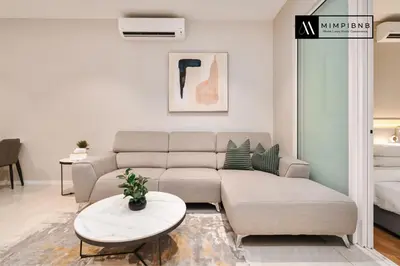 a living room with a couch and a table at Quill Residences Suite by Mimpi B&B in Kuala Lumpur