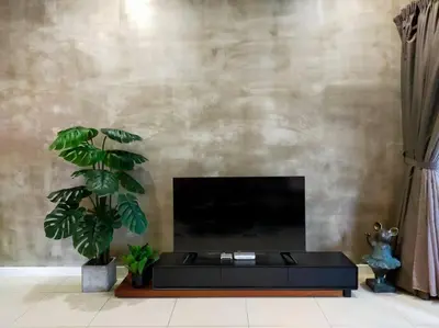 a living room with a black table and a fireplace at Luxurious Staycation Apartment in Ampang
