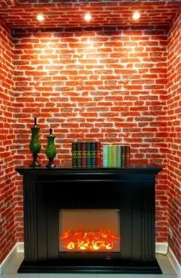 a fireplace against a brick wall with a fire at Luxurious Staycation Apartment in Ampang