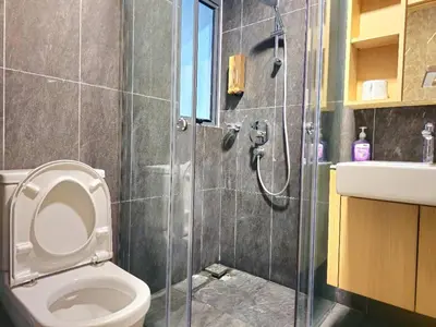 a bathroom with a shower and a toilet and a sink at Wisma Infinitum Studio 5\u5206\u949f\u62b5\u8fbe KL \u5e02\u4e2d\u5fc3 in Kuala Lumpur