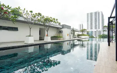 a swimming pool in the middle of a building at VIVO at 9 Seputeh by Airhost in Kuala Lumpur